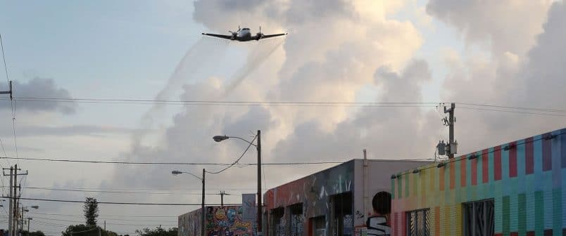 PHOTO: A plane sprays pesticide over Miamis Wynwood neighborhood on Aug. 6, 2016 in Miami.