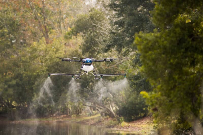 A marsh pond getting treated with a drone mosquito killer