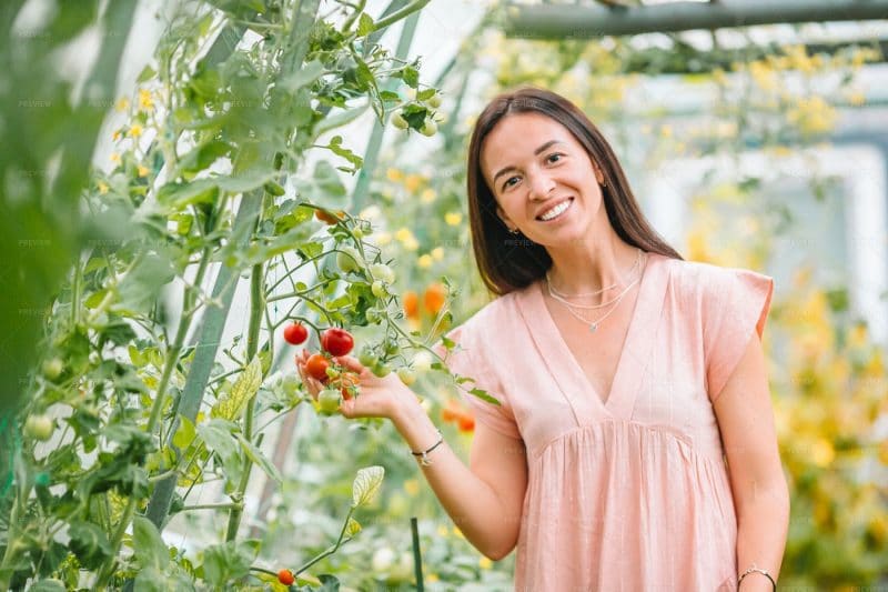 Woman happy with her fruit fly-free vegetable garden